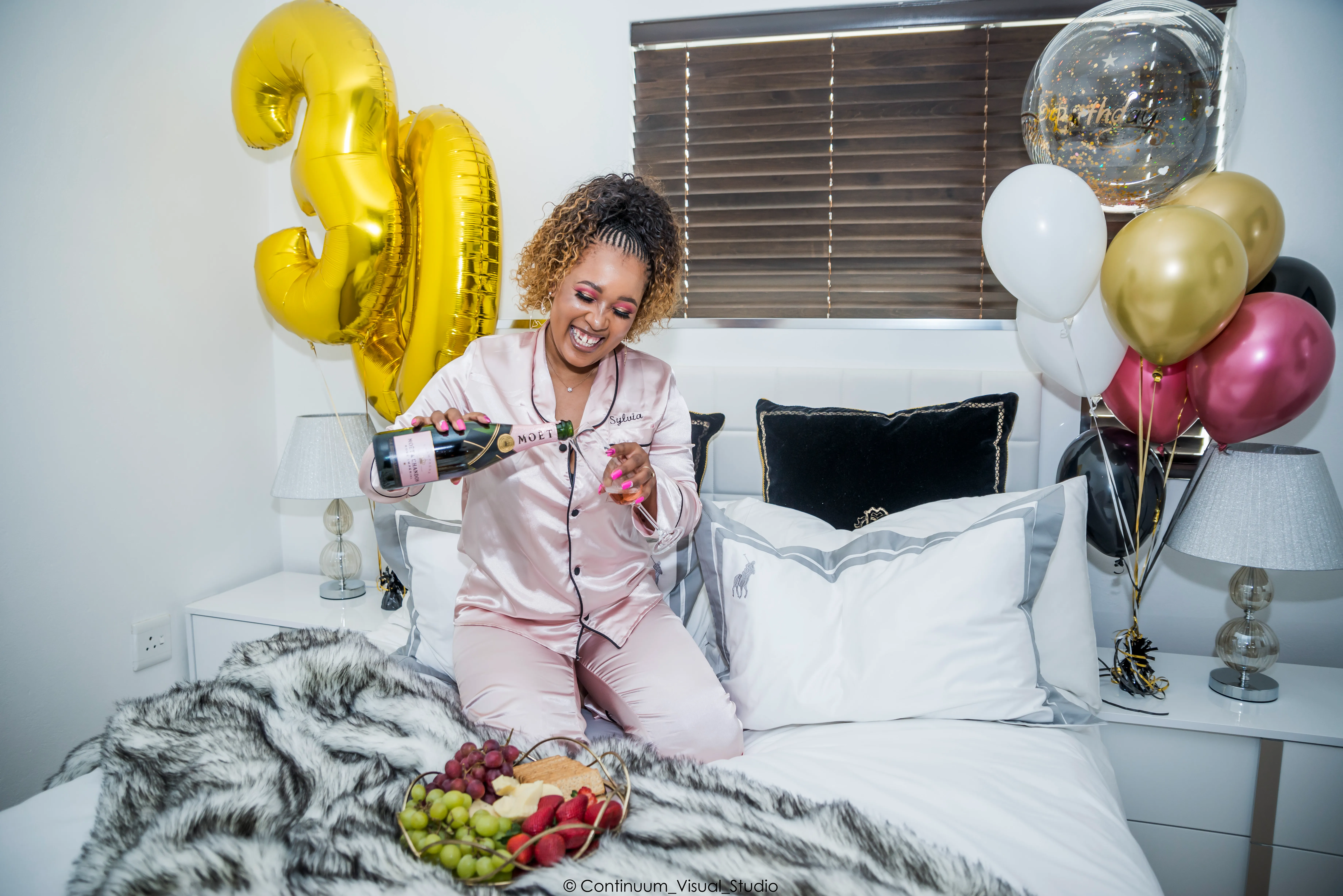 Birthday shoot — candid moment with party decorations