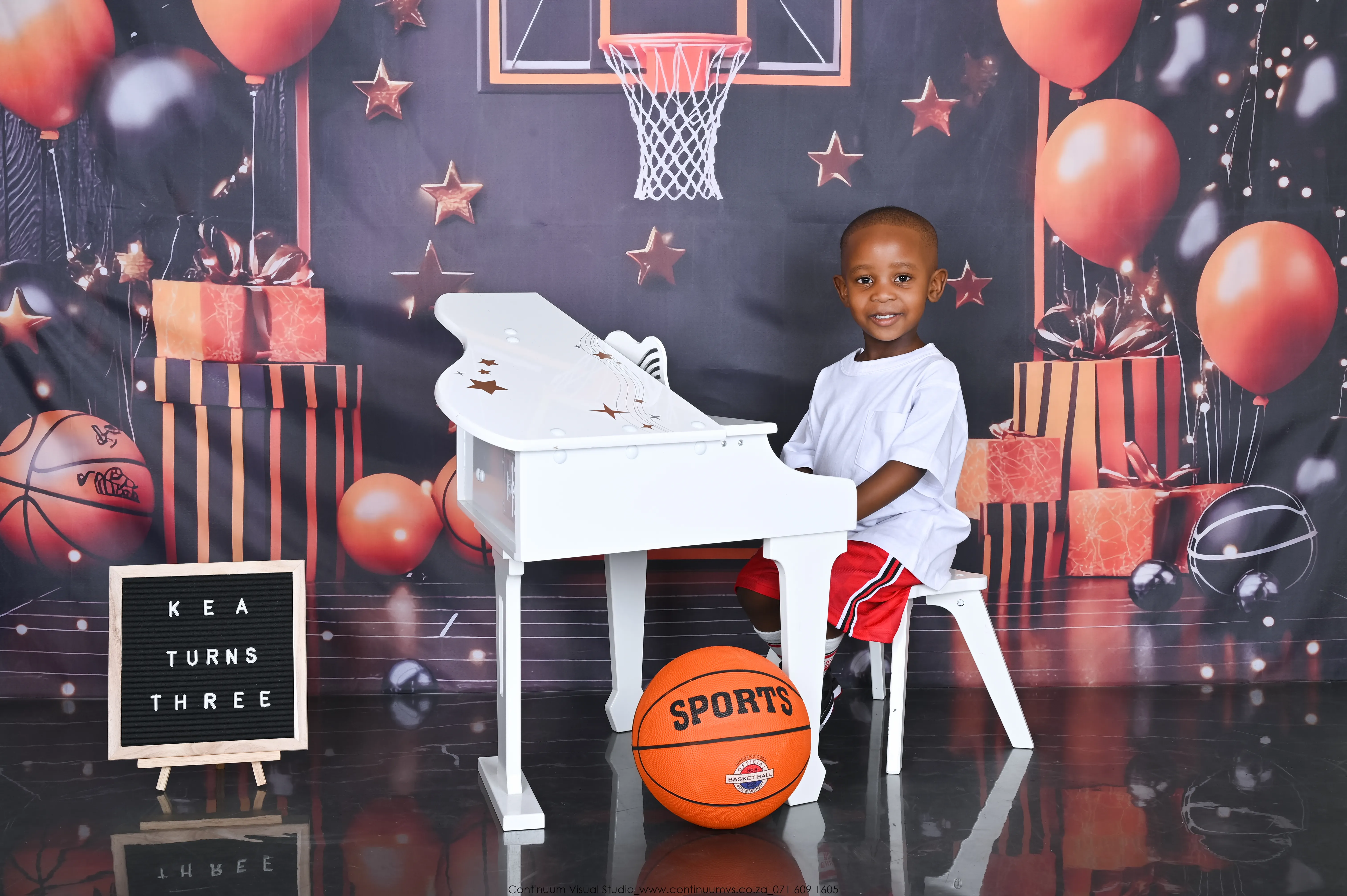 Cake smash photography — baby with birthday cake wide shot