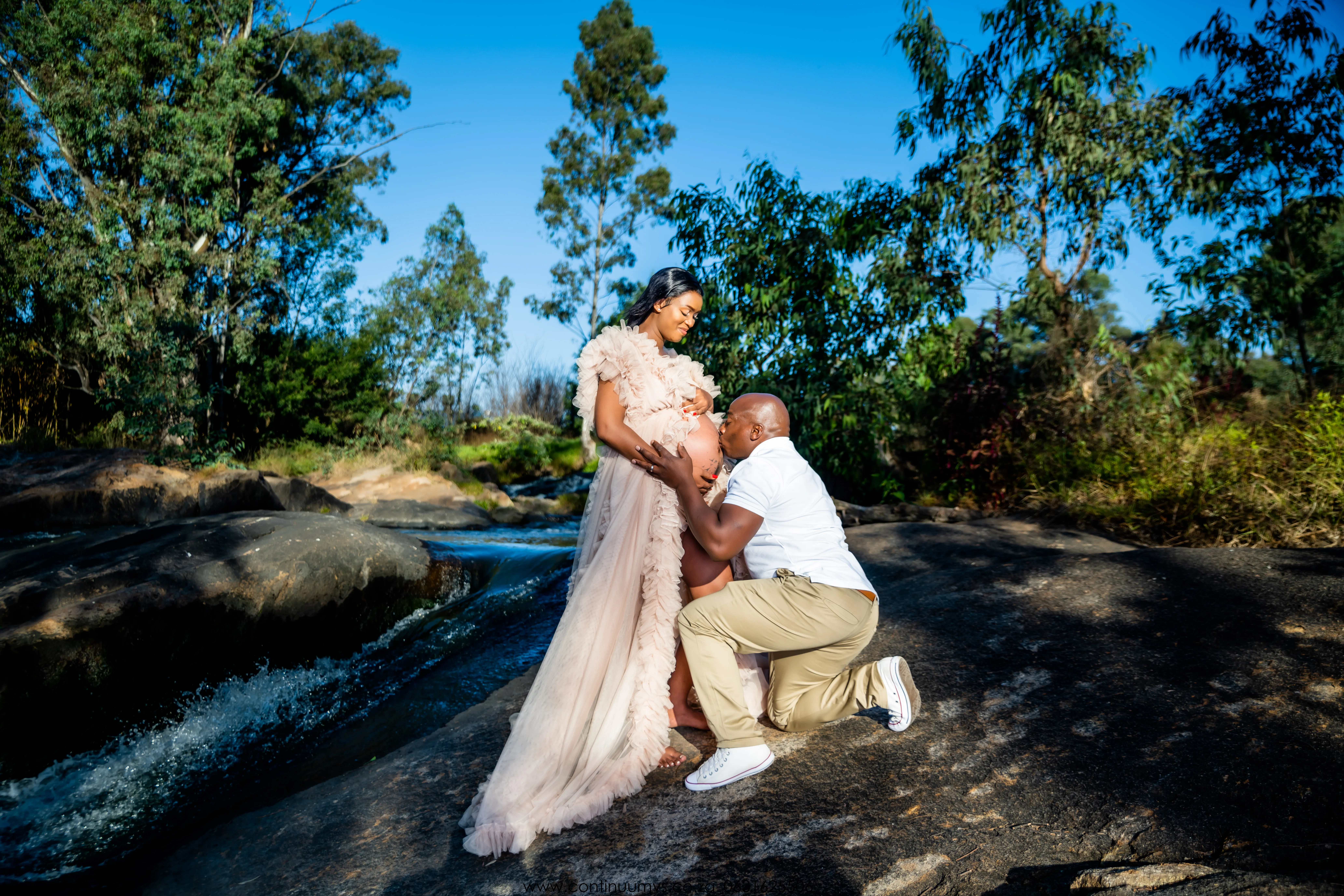 Maternity session — couple together in garden
